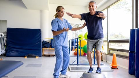 Therapist provides balance and vestibular therapy services to patient.