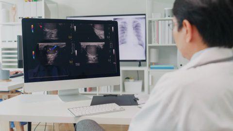 Doctor is examining results of cancer screenings tests.