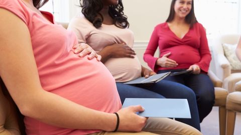 A group of pregnant women are meeting in the centering pregnancy program.