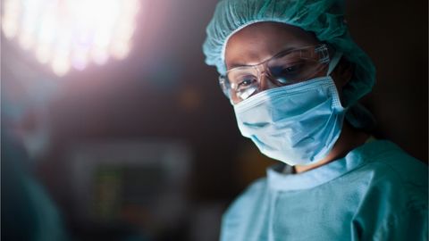 A colorectal surgeon prepares for an innovative colorectal surgery.